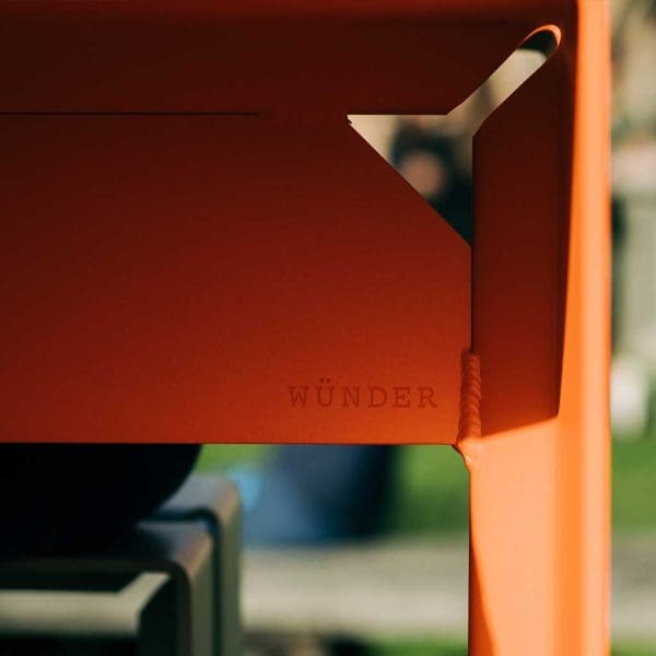 Image showing the shaped aluminium construction of The Bended orange modern garden table by Wunder