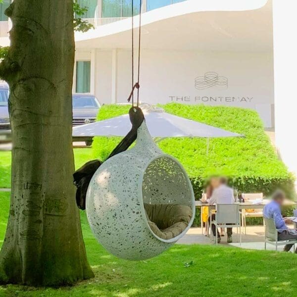 Image of white Bios Hide sofa swing outside the Fontenay Hotel in Hamburg, Germany.