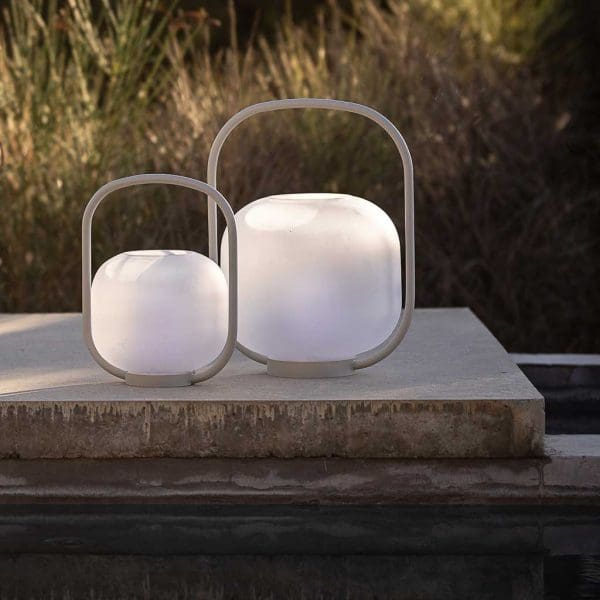 Image of pair of Otus outdoor LED lamps with taupe handles and hand-blown glass lampshade