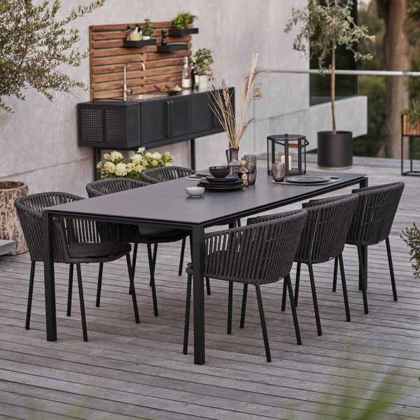 Image of dark-grey Pure garden table and dark grey Soft Rope Moments dining chairs by Cane-line
