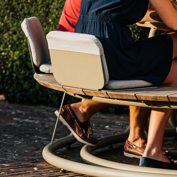 Image showing the rear of Wünder's The Seat which is made in shaped powder coated aluminium, and is shown here with The Circle round picnic table and benches