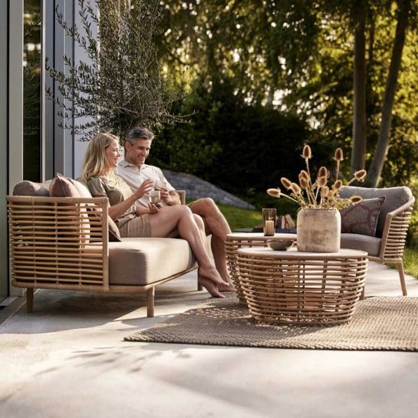 Image of Sense garden garden sofa and Basket cane outdoor low table by Cane-line