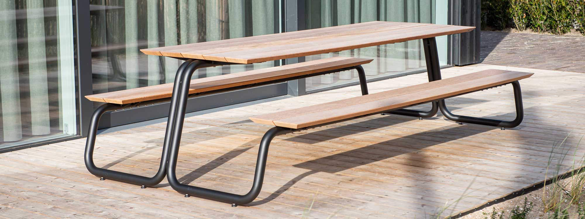 Image of The Table dark-grey picnic table and benches with tops in sustainable afzelia hardwood by Wünder, Belgium