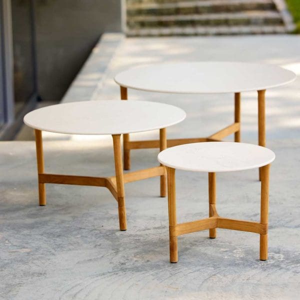 Image showing 3 different sizes of Twist teak low tables with travertine ceramic tops by Caneline