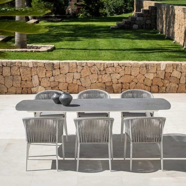 Image of Amazone white garden table with grey ceramic top, together with Fortuna Rope white garden chairs with grey-melange woven rope backs