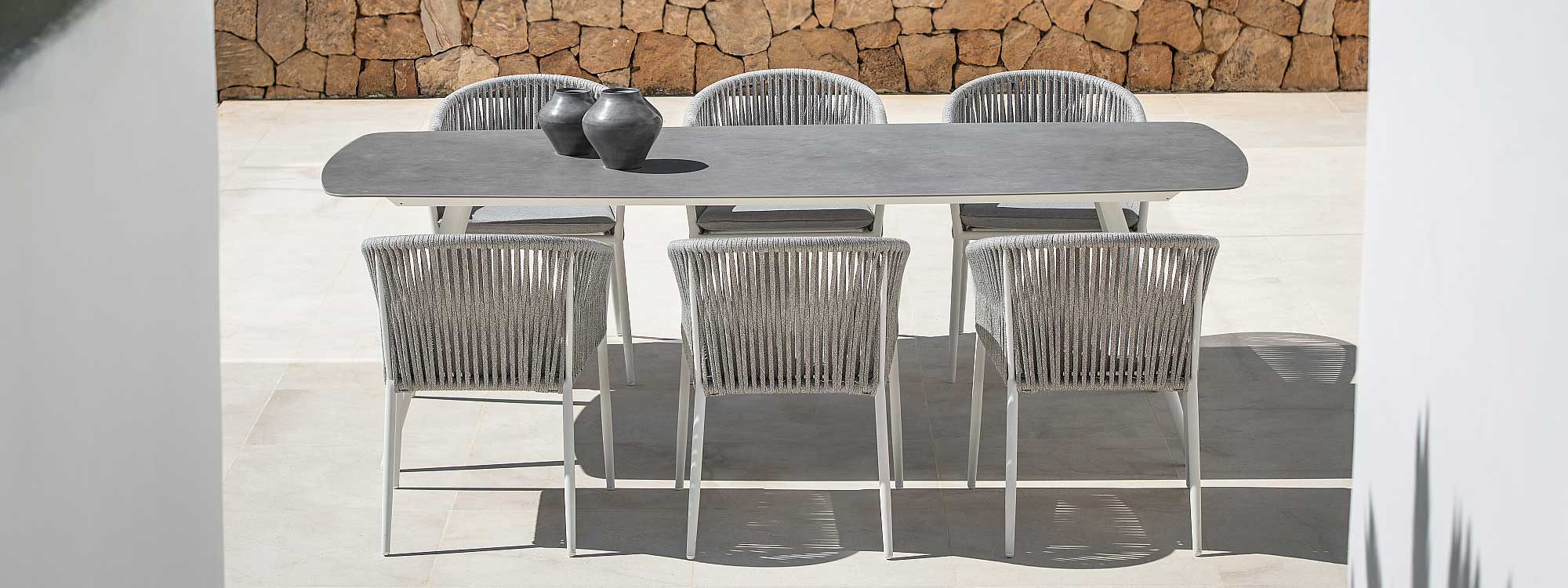 Image of Fortuna Rope white-grey garden chairs around Amazone oval garden table by Jati & Kebon