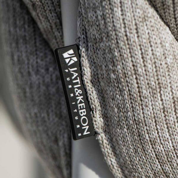 Macro image of Jati & Kebon logo label sown onto the light grey melange polyolefin sock from Fortuna Socks outdoor furniture