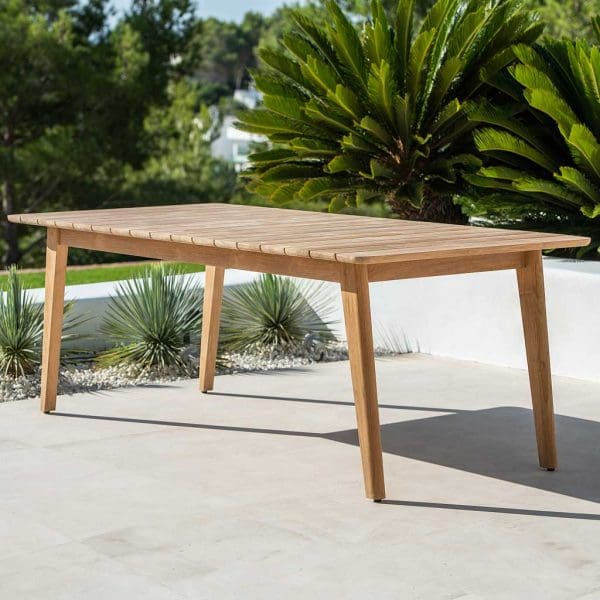 Image of Ritz rectangular teak dining table on sunny terrace