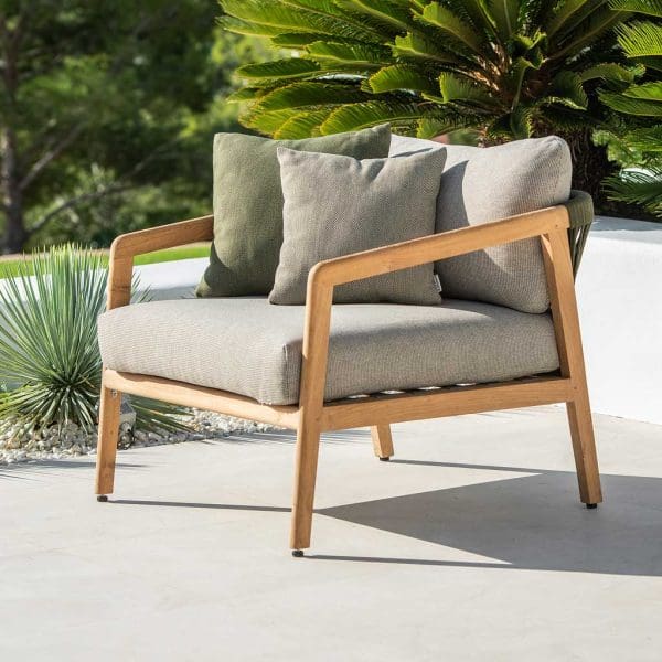 Image of Ritz outdoor lounge chair in FSC certified teak, shown with taupe back and seat cushion