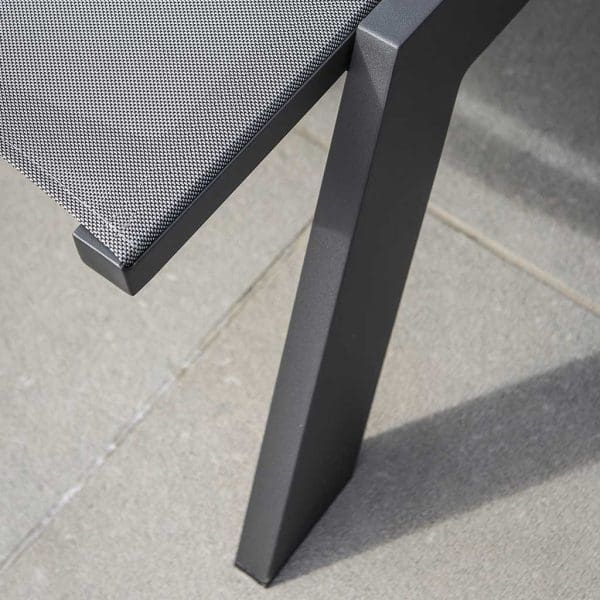Image of detail of Vigo XL sun lounger's charcoal coloured aluminium frame and silver-grey Texteline fabric seat & back by Jati & Kebon