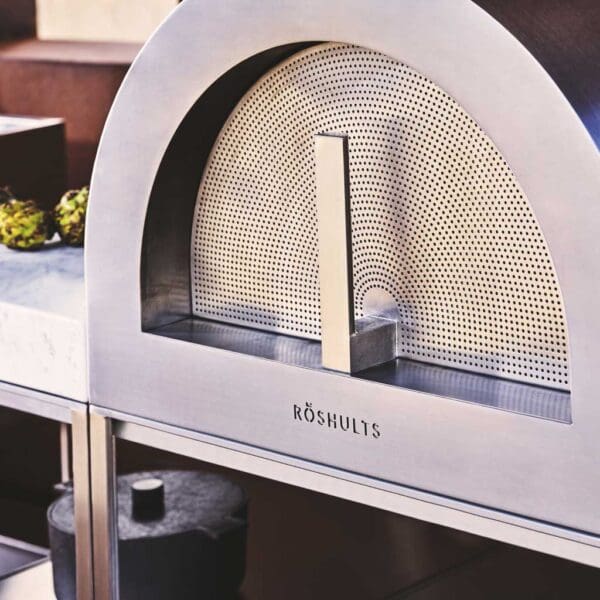 Image of detail of brushed stainless steel door for Roshults modern pizza oven