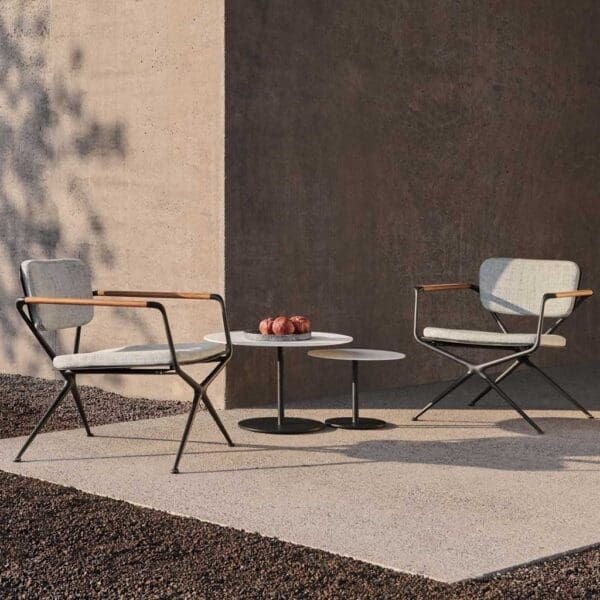 Image of pair of Exes garden lounge chairs and Butler low tables on outdoor carpet.