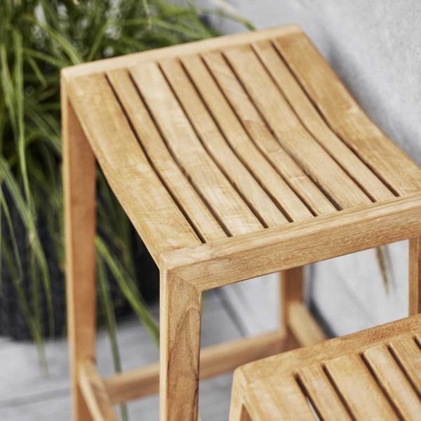 Image of top of Flip teak bar stool's slatted timber seat by Caneline