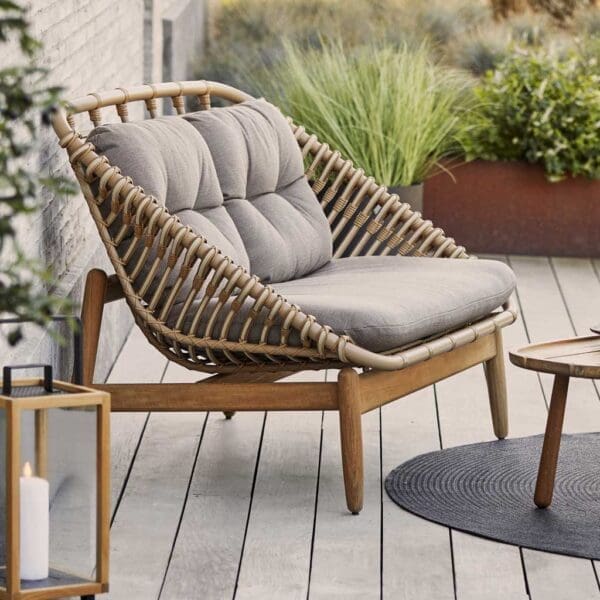 Image of Cane-line Strington 2 seater garden sofa which has design reminiscent of 1950s Scandinavian furniture