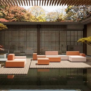 Image of Oiside Elements modular outdoor lounge furniture, shown on decking within tranquil Japanese water garden