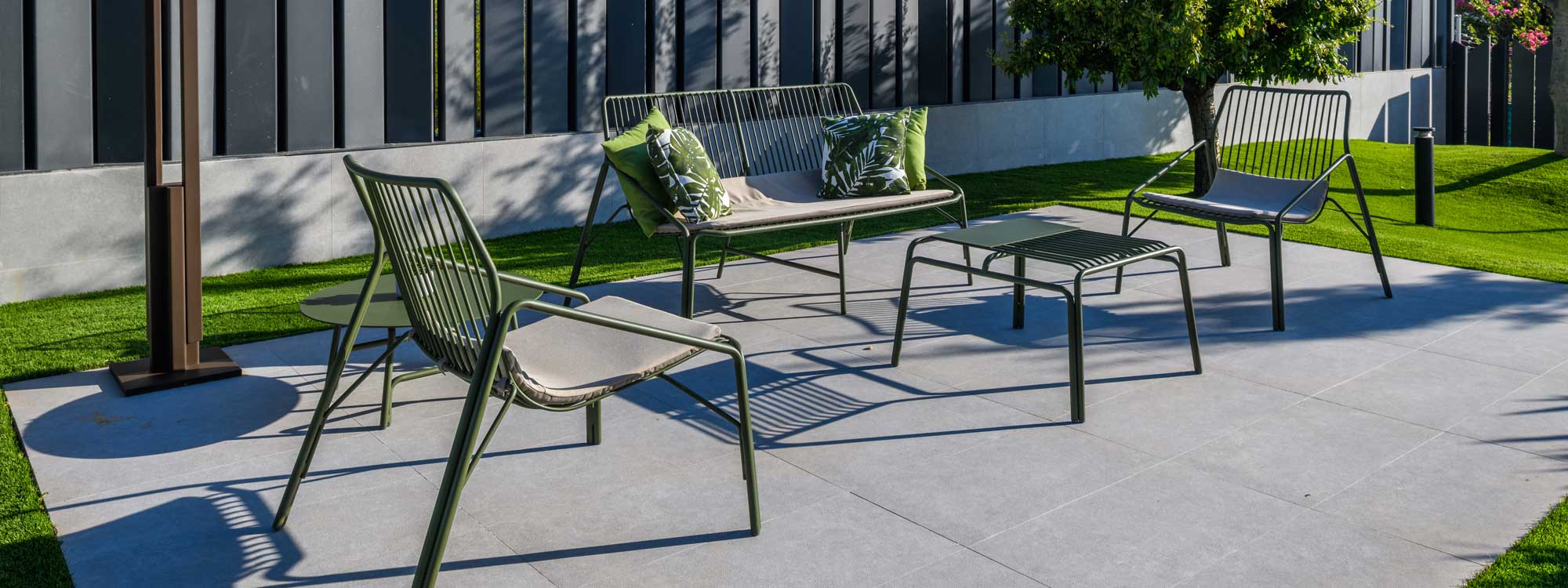Image of pair of No 12 modern garden relax chairs and a 2 seat garden sofa by Oiside, with design evocative of classic rattan garden furniture