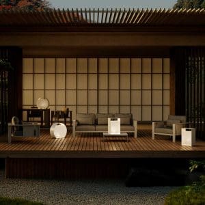 Nighttime image of OiCandles geometric garden lanterns on Japanese style terrace around Beam minimalist garden sofas