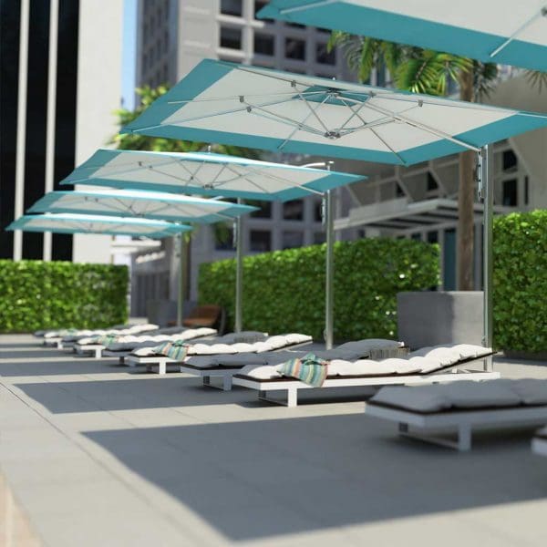 Image of row of Tuuci cantilever hospitality parasols on hotel poolside