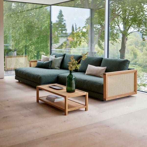 Image of Scale contemporary sofa with Fabric: Dark-green Cane-line Zen upholstery and oak arms with French weave natural rattan