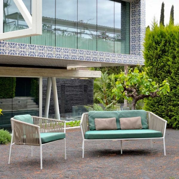 Image of Oisde Twist compact garden sofa and lounge chair, with white frame and taupe webbing and turquoise cushions