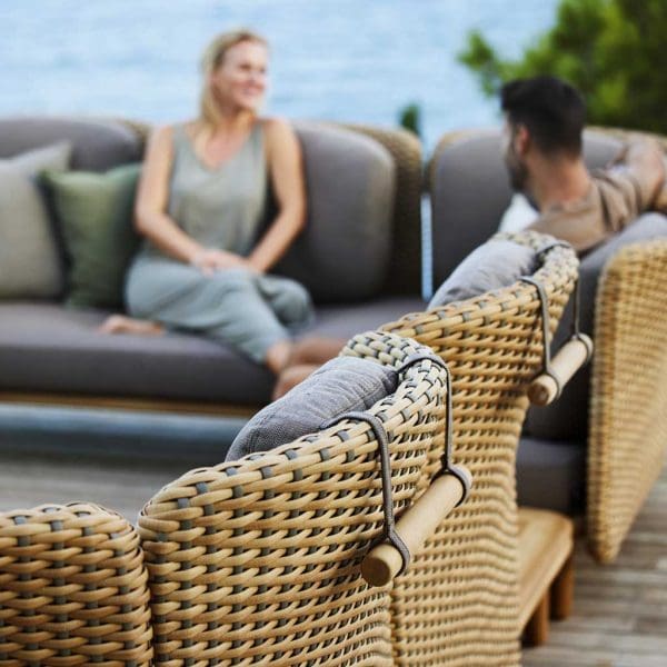 Image of detail of hand-woven taupe and natural coloured Cane-line Flat weave and Taupe AirTouch cushions from Arch garden sofa