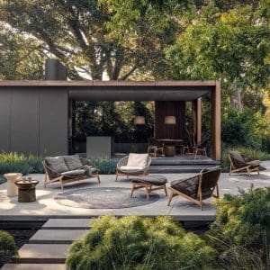 Image of Gloster Bora contemporary garden sofa and lounge chair on minimalist terrace, with Japanese garden in the foreground
