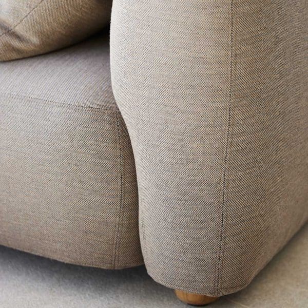 Image of detail of Capture garden sofa's Taupe Cane-line AirTouch cushions and teak feet