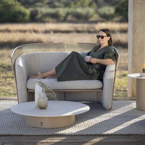Image of woman relaxing in Slide 2 seater modern garden sofa by Todus