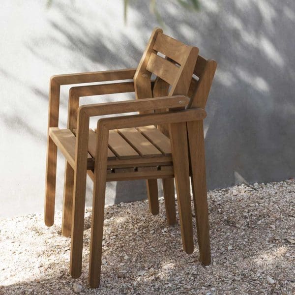 Image of pair of stacked Zania wooden hospitality chairs in FSC iroko hardwood by RODA