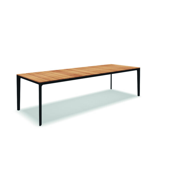 Studio image of large Gloster Carver teak dining table