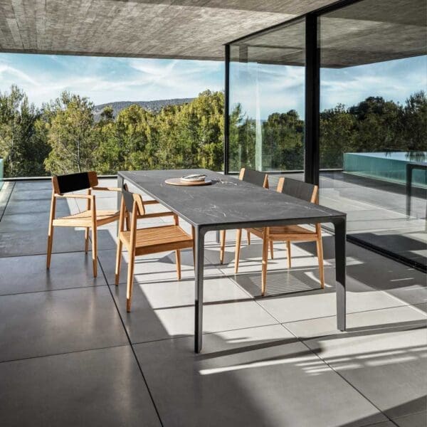 Image of Carver ceramic garden table and Archi teak dining chairs by Gloster