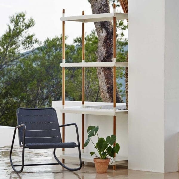 Image of Frame white and teak garden shelves and Copenhagen outdoor rocking chair by Cane-line