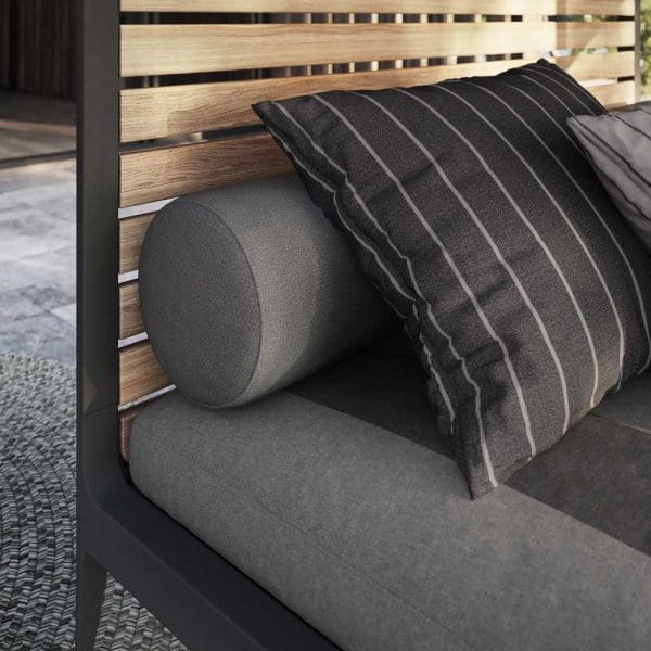 Image of detail of Grid Cabana's teak louvres, anthracite aluminium frame and grey cushions by Gloster