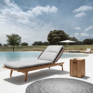 Image of Gloster Kay contemporary teak sun lounger & Block side table on poolside