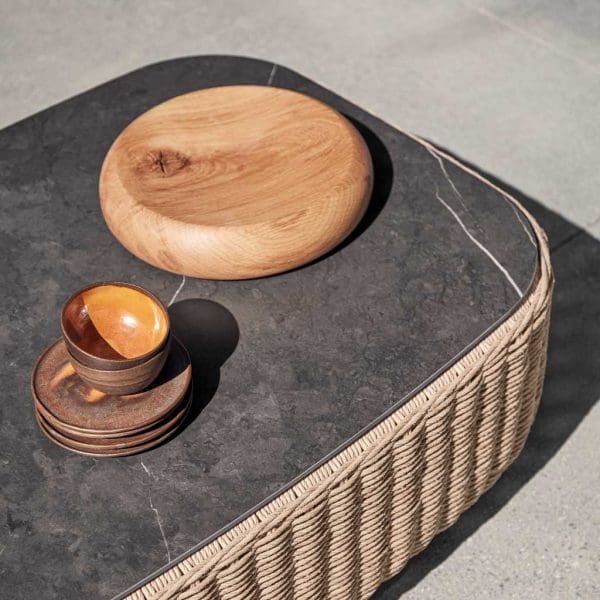 Image of Nero ceramic table top on Omada modern rattan coffee table by Gloster