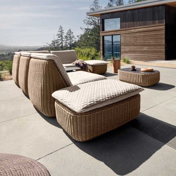 Image of rear showing organic flowing form of Omada modern garden sofa by Gloster