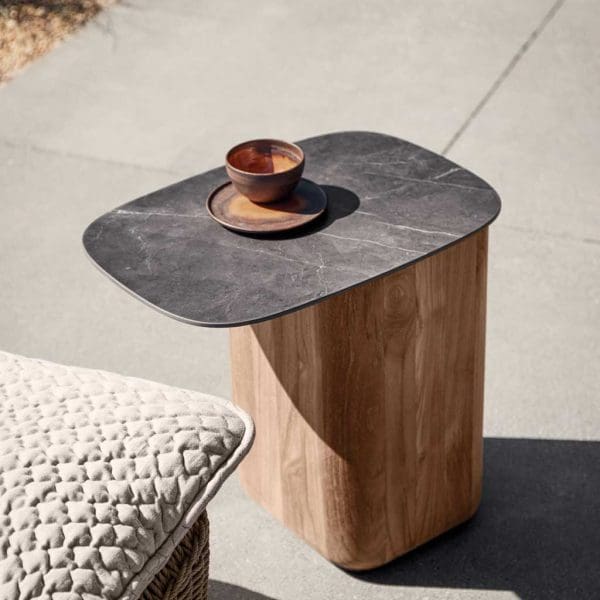 Image of Omada teak side table with offset ceramic table top by Gloster