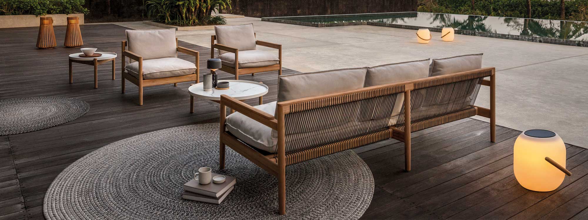 Image of Gloster Saranac 3 seater teak sofa and lounge chairs, together with Sepal exterior low tables