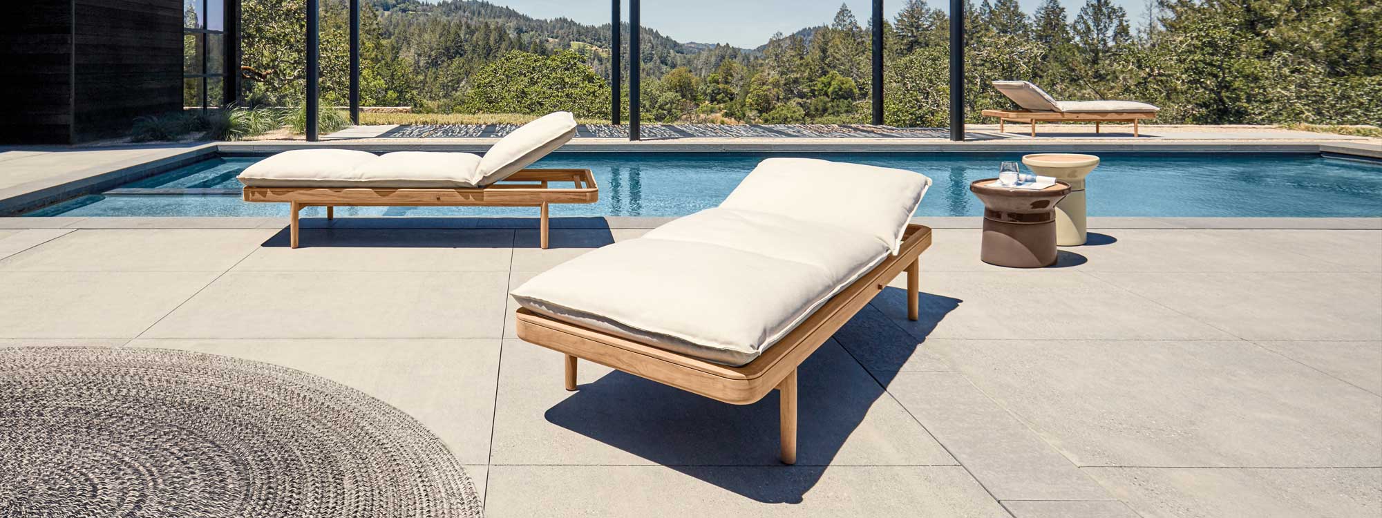 Image of pair of Saranac contemporary teak sun beds by Mark Gabbertas for Gloster