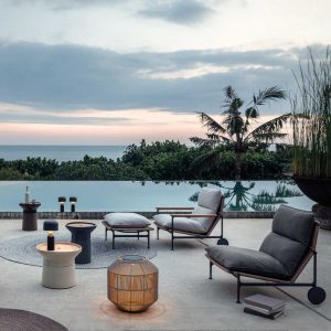 Image of Zenith garden lounge chairs with wheels and Basket outdoor lanterns by Gloster