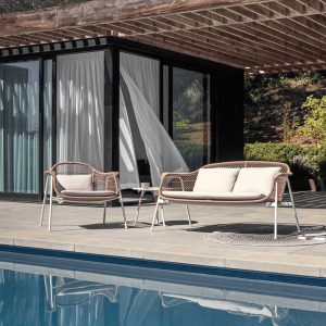 Image of Fresco 2 seat garden sofa and lounge chair on sunny poolside terrace