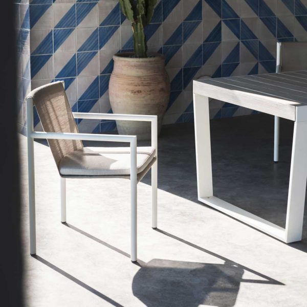Image of RODA Plein Air garden dining armchair and Spinnaker extending outdoor table