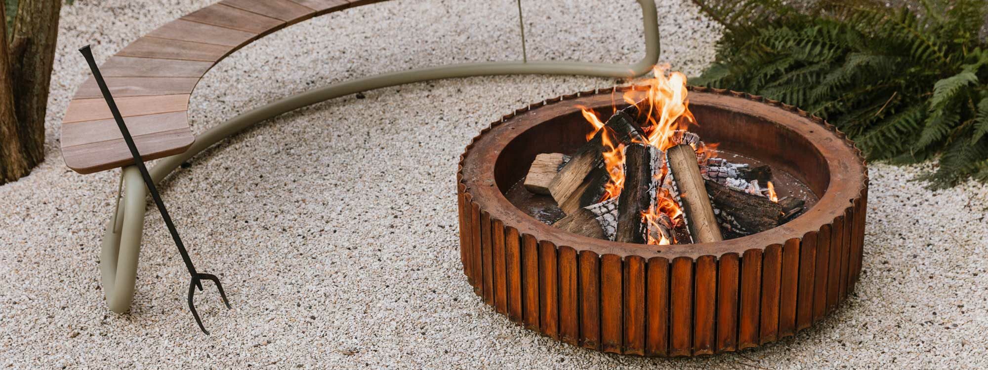 Image of The Ring corten steel fire pit and The Circle circular garden bench by Wünder, Belgium.