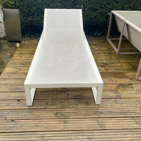 Image of FueraDentro Siesta minimalist sun bed on wet decking
