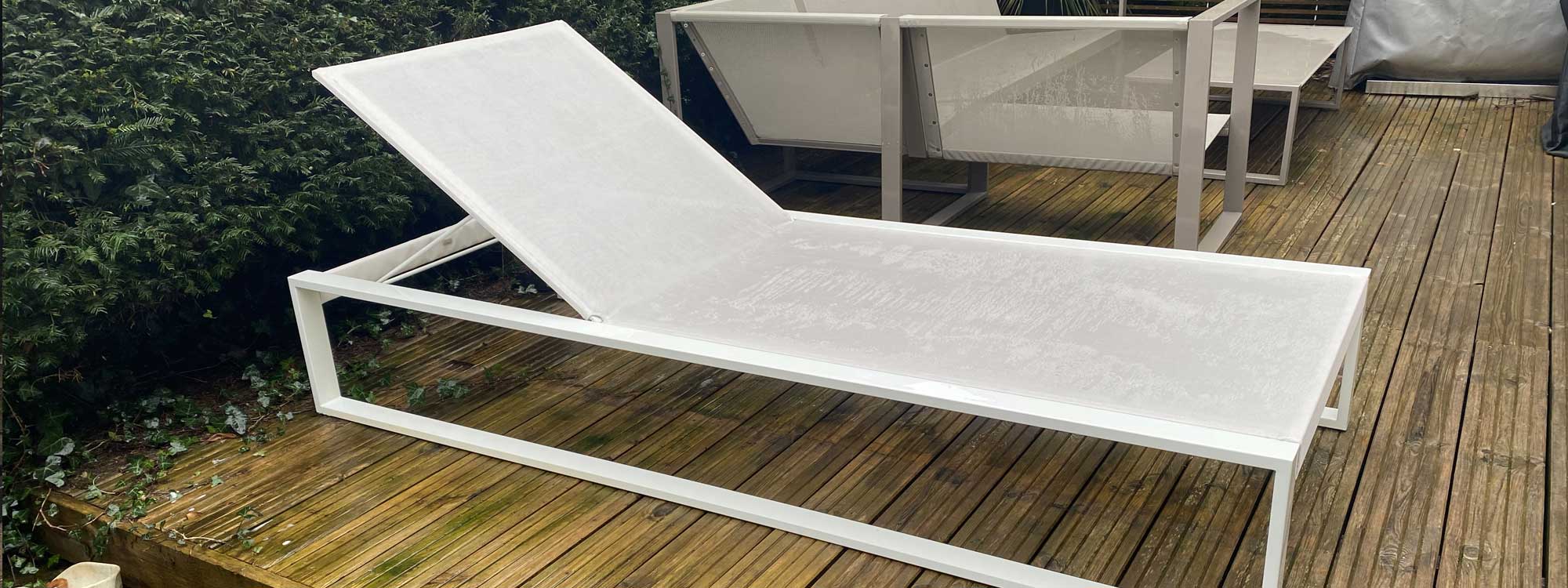 Image of FueraDentro Siesta luxury sun lounger in white stainless steel and white batyline