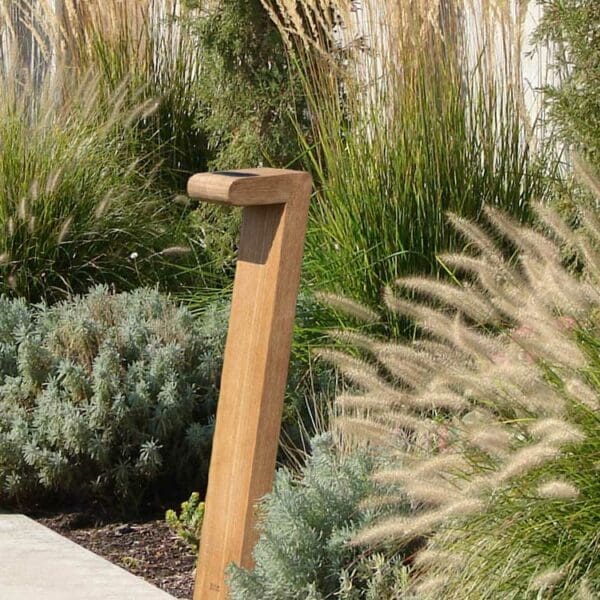 Image of Septem teak post light by Royal Botania, with grasses to the side and in the background