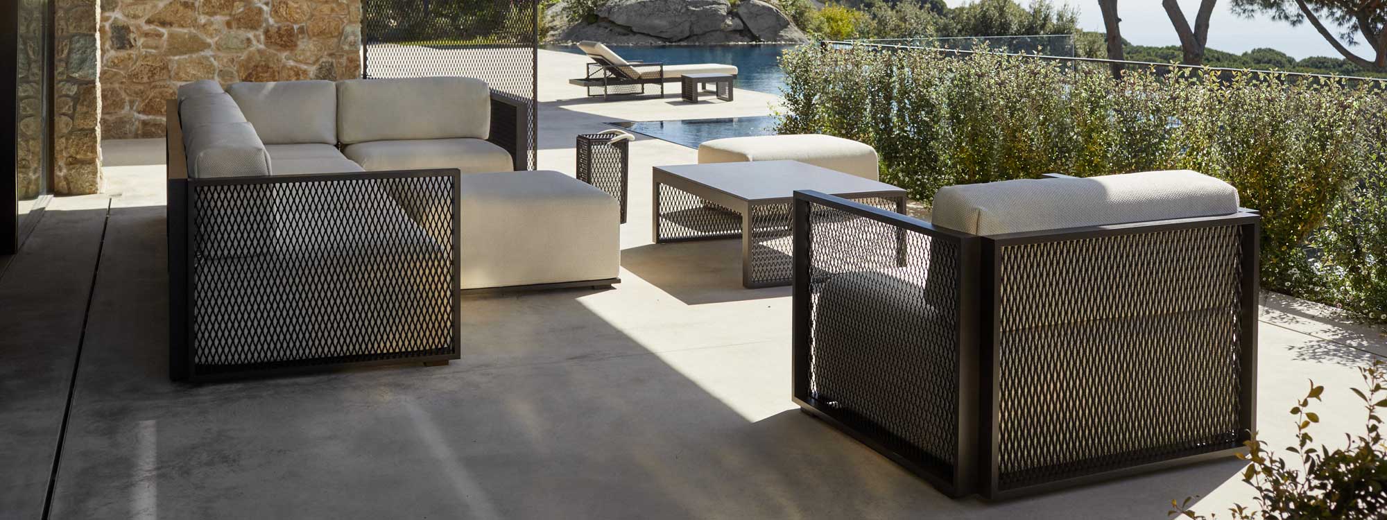 Image of Vondom The Factory modern outdoor lounge set in the light and shade of a sunny Mediterranean terrace