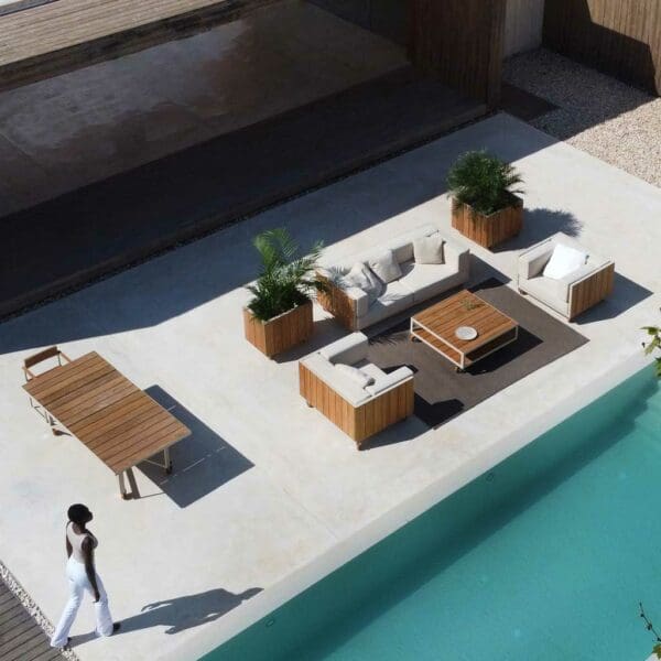 Image of aerial view of Vineyard modern garden dining set and lounge furniture on sunny poolside terrace