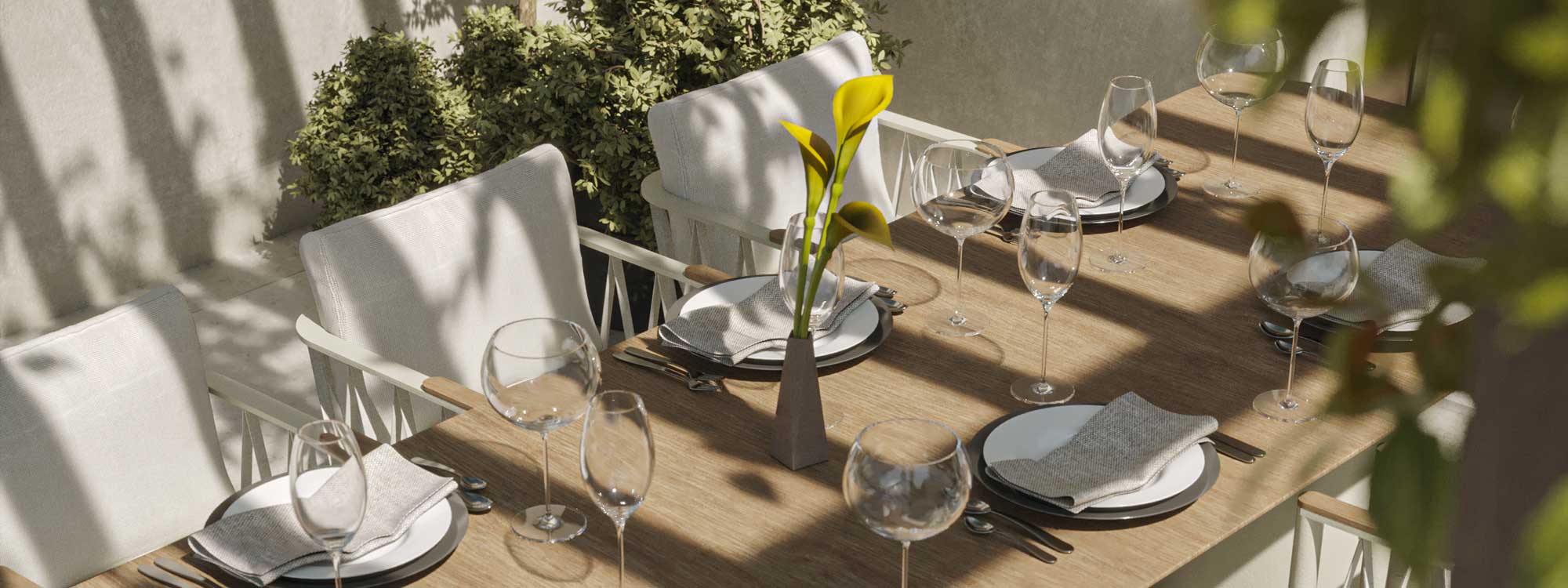 Image of Ava garden dining table's iroko-style HPL top with white AVA garden chairs to the back by Oiside
