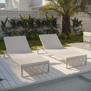 Image of Ava modern sunbeds by Oiside on white decking with tropical plants in the background
